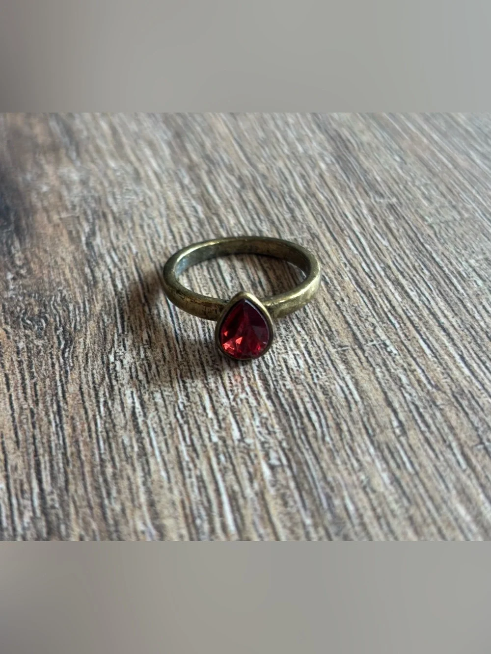 Fashion Jewelry Women’s size 10.5 brass tone pear shape red stone bezel ring